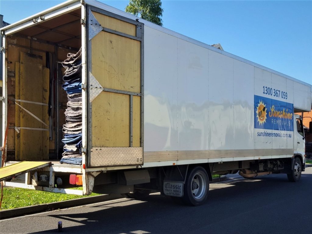 Sunshine removalists truck. moving furniture new home.